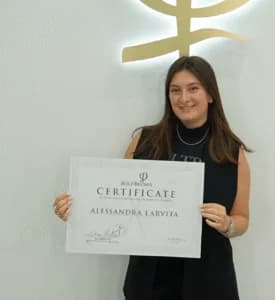 Alessandra holding her UK Hair & Beauty Awards certificate